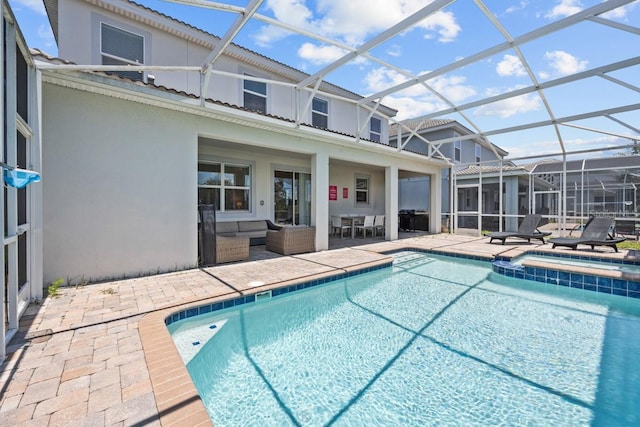 view of pool featuring an in ground hot tub, a patio, an outdoor hangout area, and a lanai