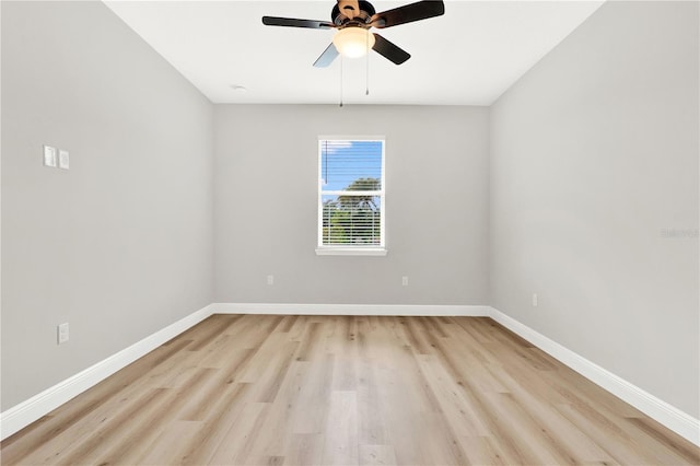 empty room with ceiling fan and light hardwood / wood-style floors