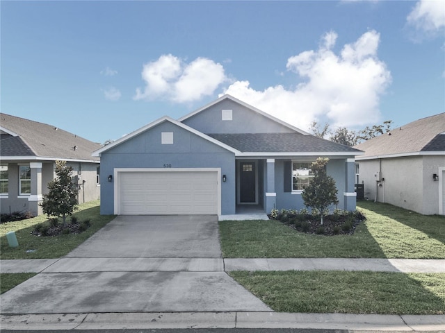 single story home featuring a garage and a front yard