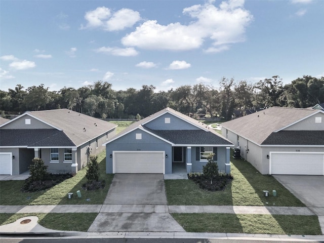 single story home featuring a front lawn and a garage