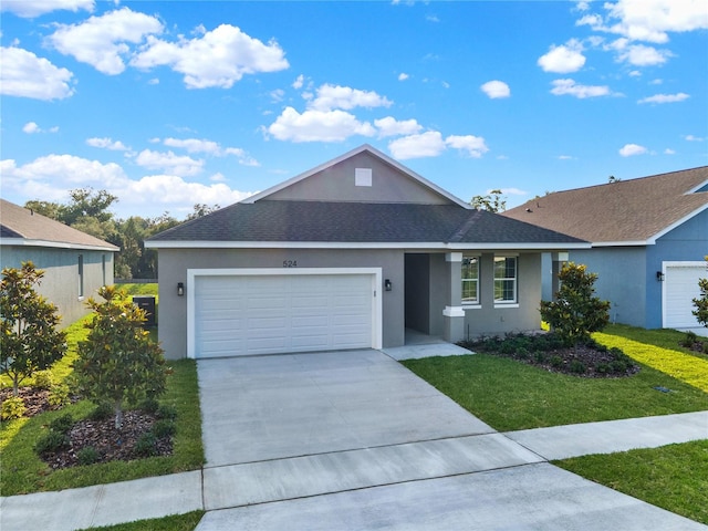 view of front of house with a front lawn and a garage