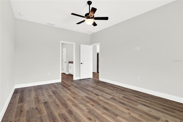 spare room with ceiling fan and hardwood / wood-style flooring