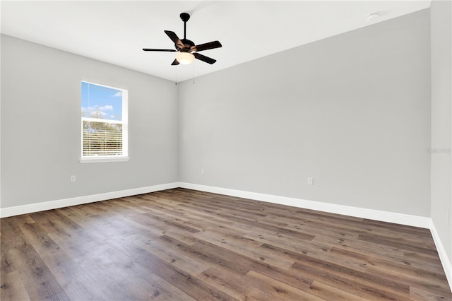 unfurnished room featuring ceiling fan and hardwood / wood-style floors