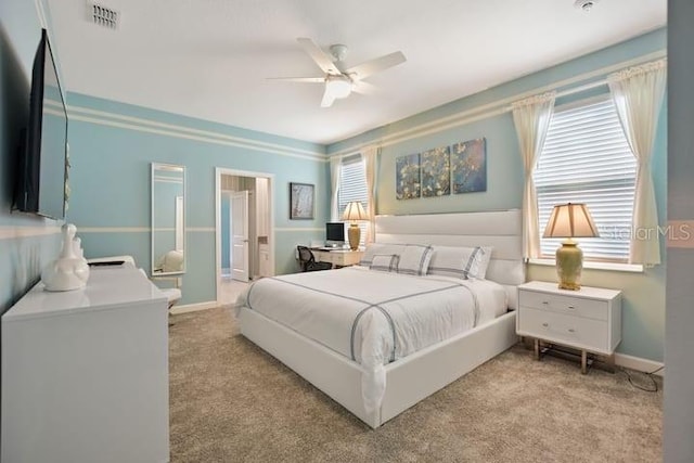 bedroom featuring ceiling fan, connected bathroom, and carpet flooring