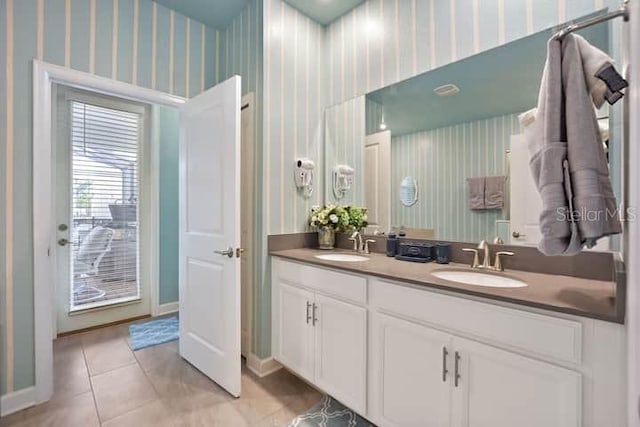 bathroom with tile floors and double sink vanity