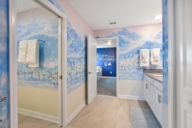 bathroom featuring tile floors and vanity