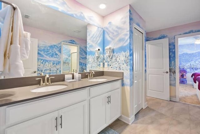 bathroom featuring tile floors and dual bowl vanity