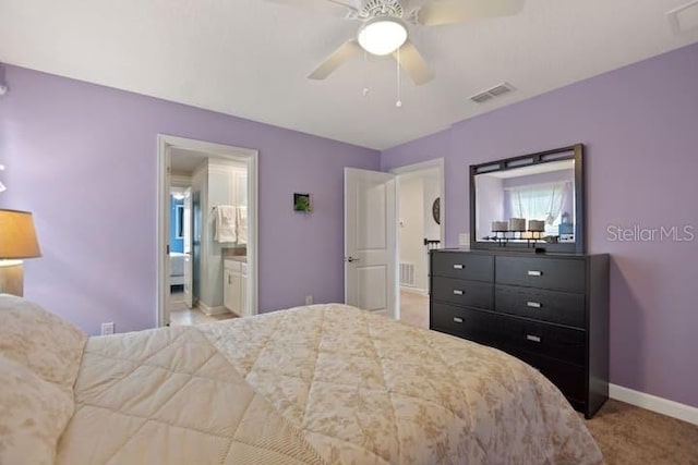 bedroom with connected bathroom, ceiling fan, and carpet floors