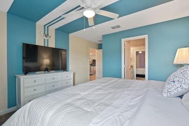 bedroom featuring ensuite bathroom and ceiling fan