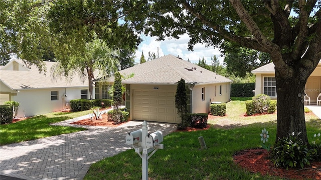 single story home with a garage and a front yard