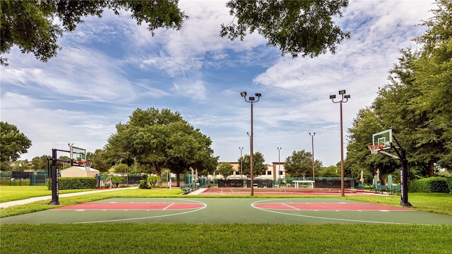 view of basketball court featuring a yard