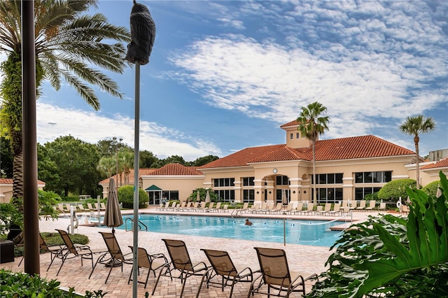 view of swimming pool featuring a patio area