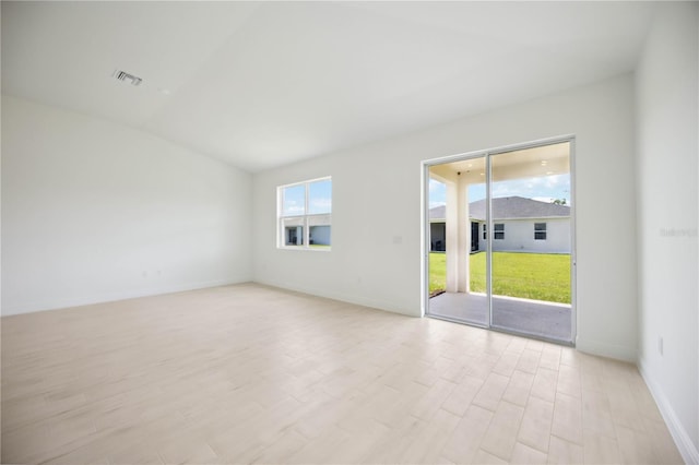 spare room featuring light wood-type flooring