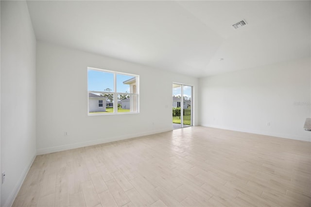 empty room with light hardwood / wood-style floors