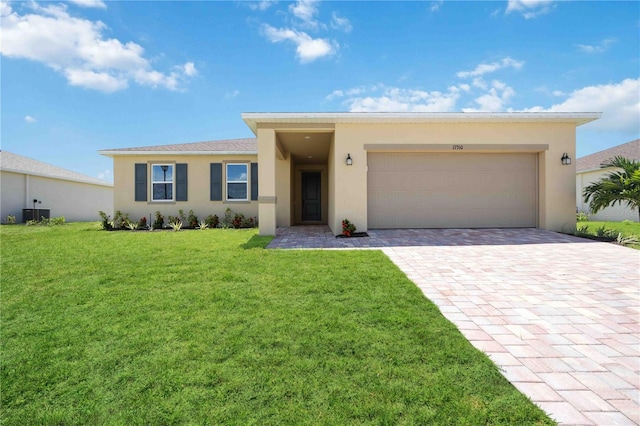 view of front of house with a garage and a front yard