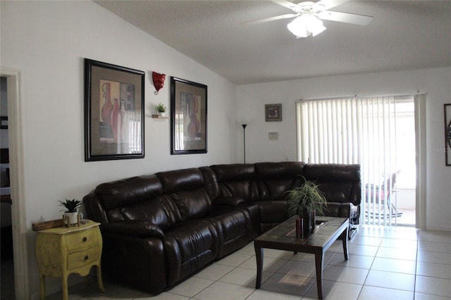 tiled living room with ceiling fan and vaulted ceiling