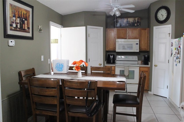 tiled dining area featuring ceiling fan