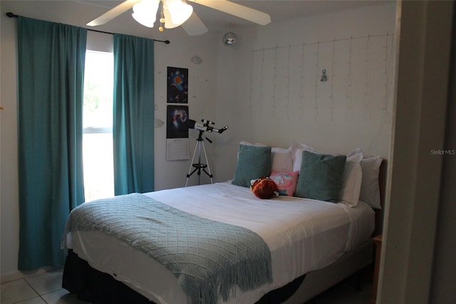 bedroom featuring tile flooring and ceiling fan