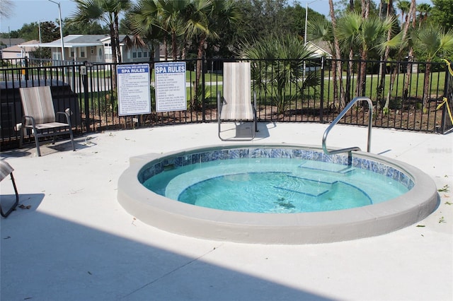 view of pool with a community hot tub