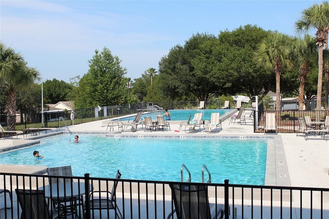 view of swimming pool with a patio area