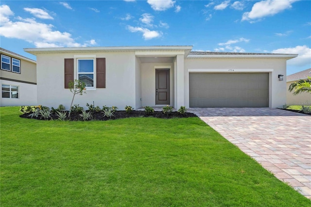 ranch-style house with decorative driveway, an attached garage, and stucco siding