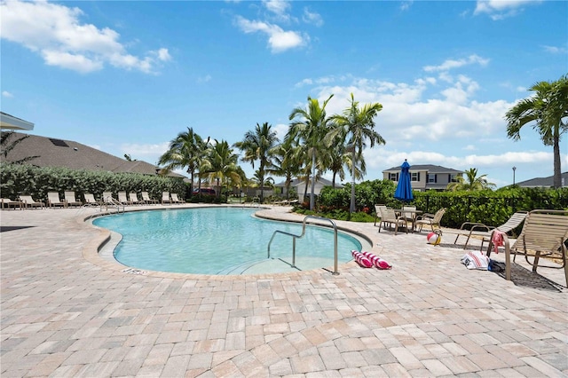 view of swimming pool featuring a patio area