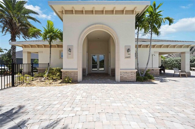 entrance to property featuring a patio