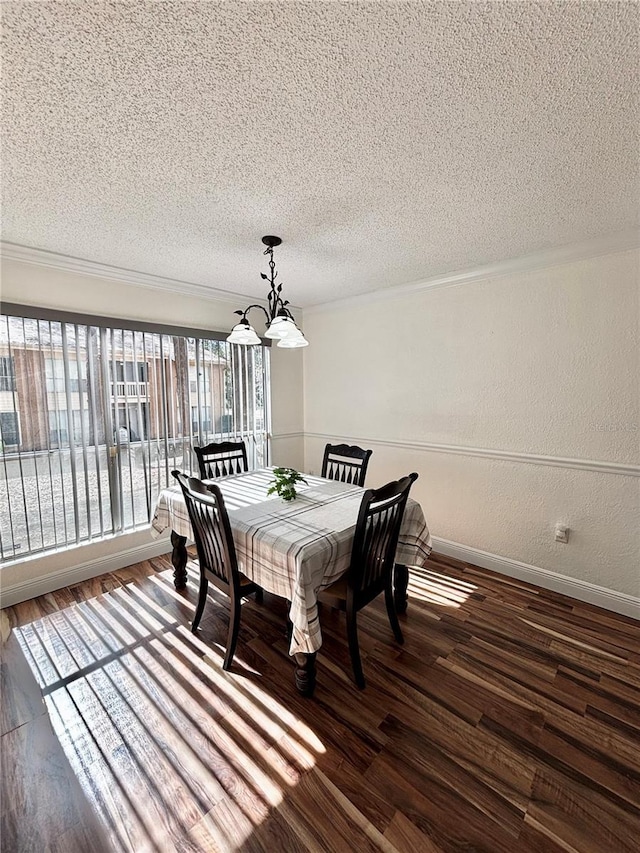 dining area with dark hardwood / wood-style flooring, a chandelier, and a textured ceiling