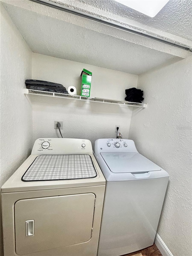 laundry room featuring washing machine and clothes dryer