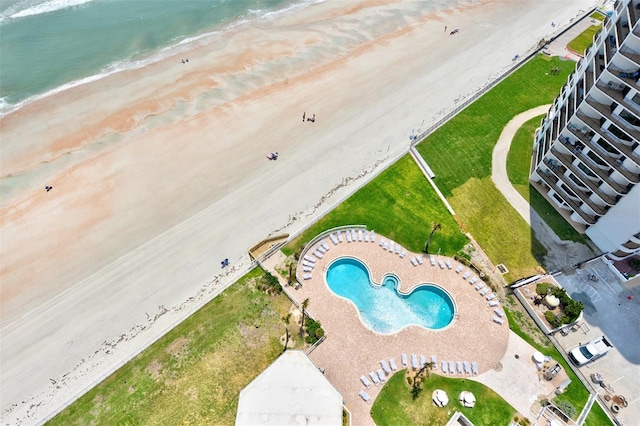 drone / aerial view with a beach view and a water view