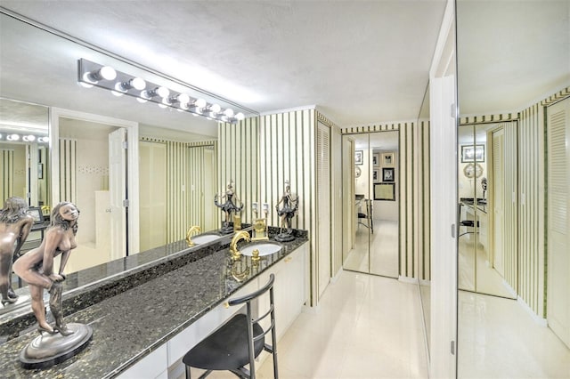 bathroom featuring tile floors, a textured ceiling, and vanity