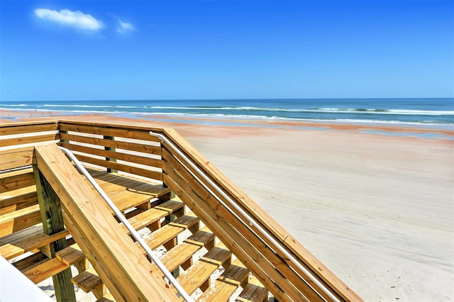 view of nearby features featuring a view of the beach and a water view