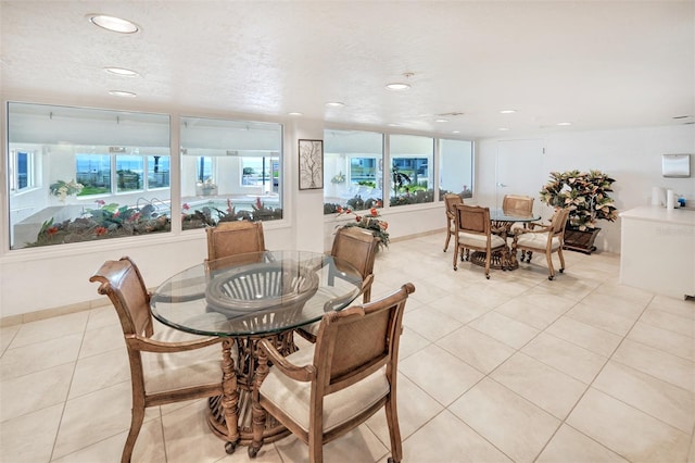 dining space with light tile flooring