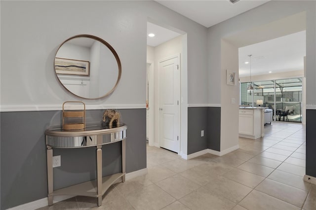 corridor featuring light tile flooring