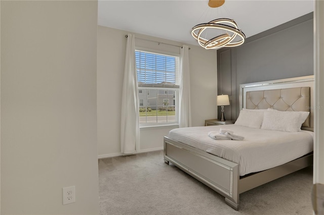 carpeted bedroom featuring multiple windows