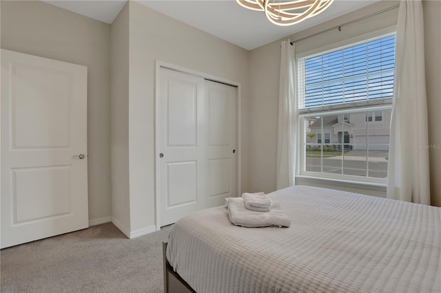 bedroom with carpet flooring and a closet