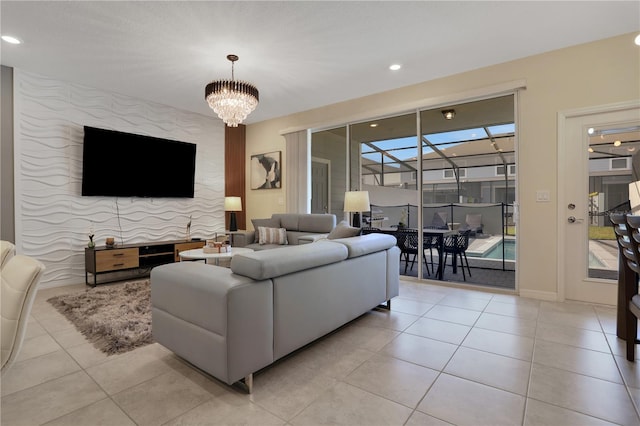 living room featuring a notable chandelier and light tile flooring