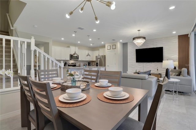 tiled dining space with a notable chandelier