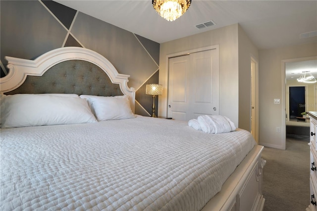 bedroom featuring carpet flooring, a notable chandelier, and a closet