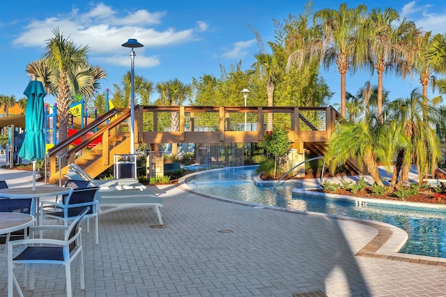 view of swimming pool with a patio area and pool water feature