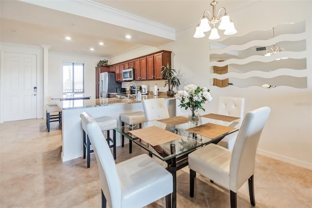 tiled dining area with an inviting chandelier and crown molding