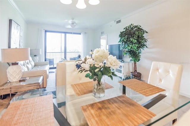 dining area featuring crown molding