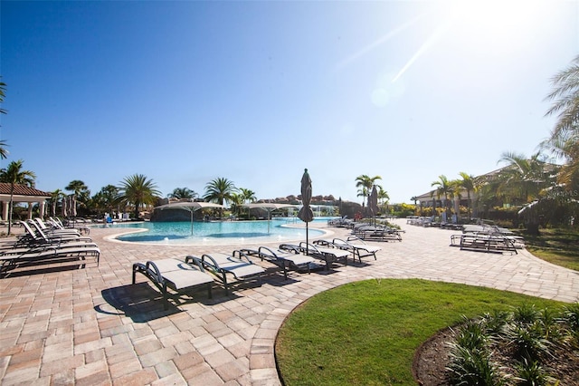 view of pool featuring pool water feature and a patio area