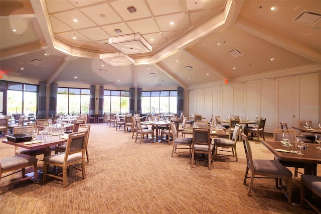 carpeted dining room featuring a wealth of natural light and high vaulted ceiling