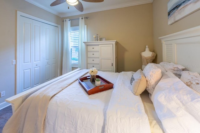 bedroom featuring ornamental molding, ceiling fan, and a closet