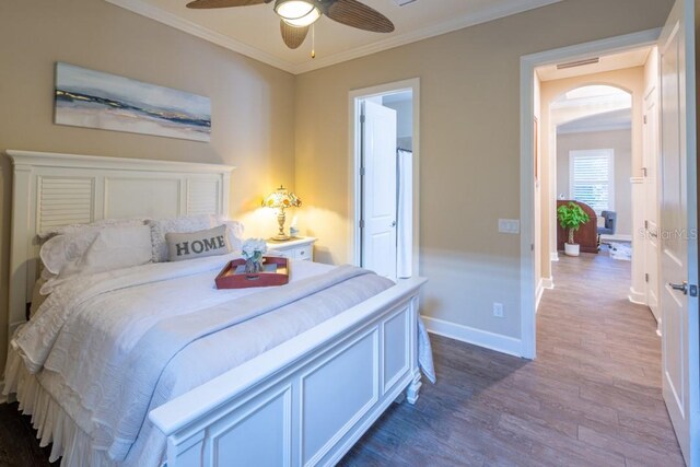 bedroom with ceiling fan, hardwood / wood-style flooring, and crown molding