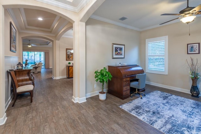 office with dark hardwood / wood-style flooring, ornamental molding, and ceiling fan