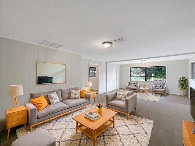 living room featuring wooden walls