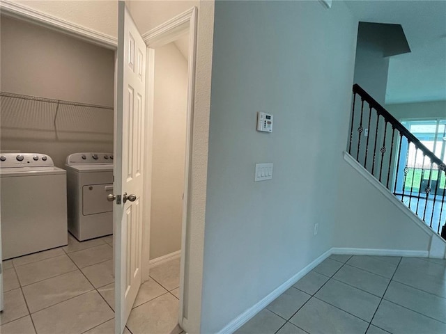 laundry area featuring light tile patterned flooring and independent washer and dryer