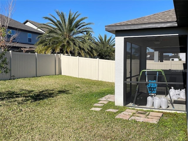 view of yard featuring a sunroom